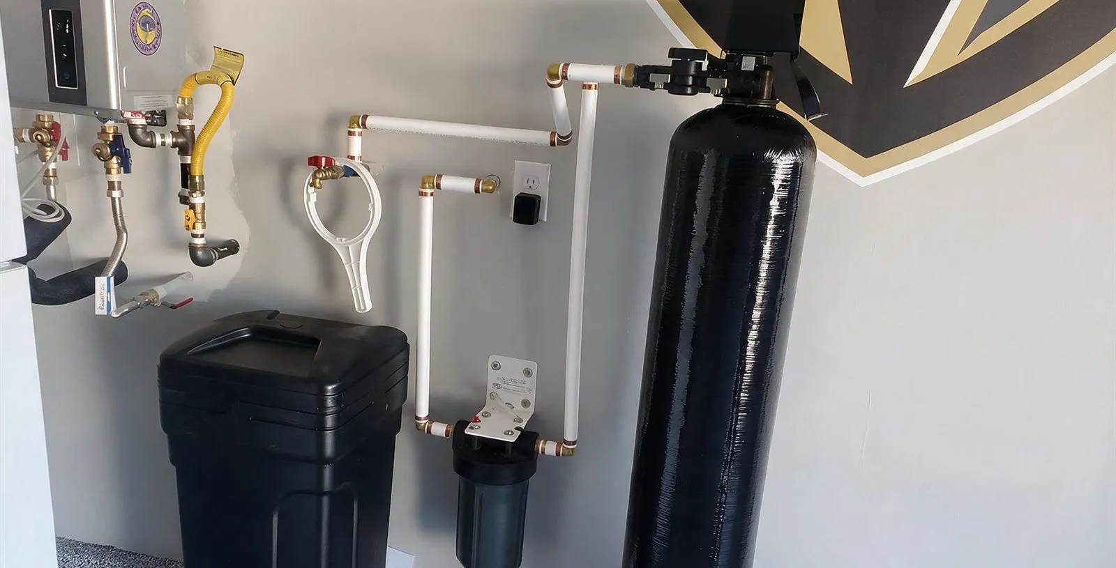 A completed whole-home water softener install in a Las Vegas garage